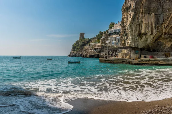 stock image Surf breaking on the beach at Marina di Praia, Praiano,, Italy on a sunny day