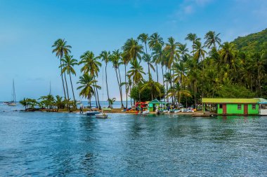 A view out to sea from Marigot Bay, St Lucia in the morning clipart