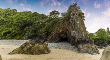 Ladies Cave on the Glen Beach, Saundersfoot, Wales at low tide in  summer; a spectacular example of an anticline clipart