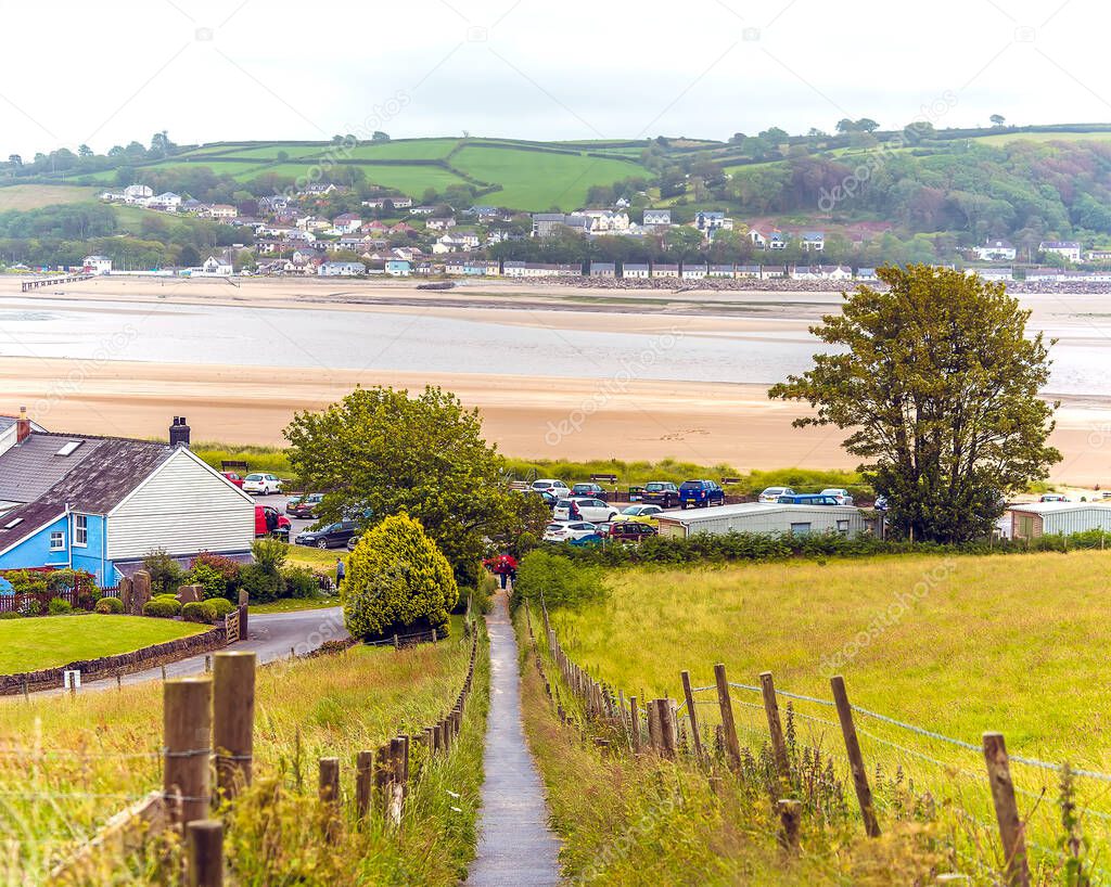 A view over the village of Llansteffan, Wales across the river Towy towards Ferryside in the summertime