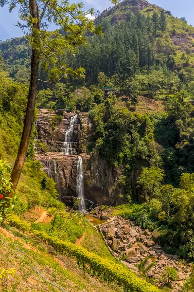 Water cascades over the Ramboda falls in upland tea country in Sri Lanka, Asia