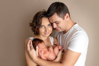 mom and dad hold a newborn baby, replenishment in the family, discharge from the hospital, happy family clipart
