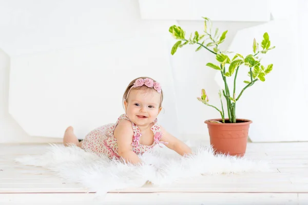 Small Child Girl Lying Her Stomach Bright White Room Red — Stock Photo, Image