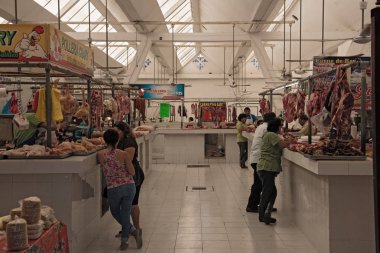 CHETUMAL, MEXICO-MARCH 09, 2018: Butcher in the Mercado Ignacio Manuel Altamirano, Chetumal, Mexico clipart