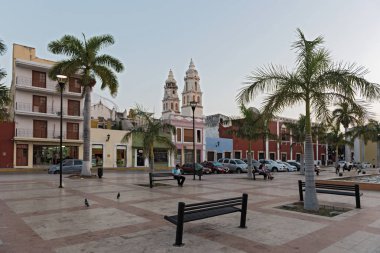 CAMPECHE, MEXICO-MARCH 14, 2018: plaza de la republica and the cathedral san francisco de campeche at dusk, mexico, clipart