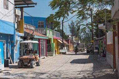 HOLBOX, MEXICO-MARCH 24, 2018: Sandy road with tourists and stalls on Holbox Island, Quintana Roo, Mexico located in north yucatan peninsula, clipart