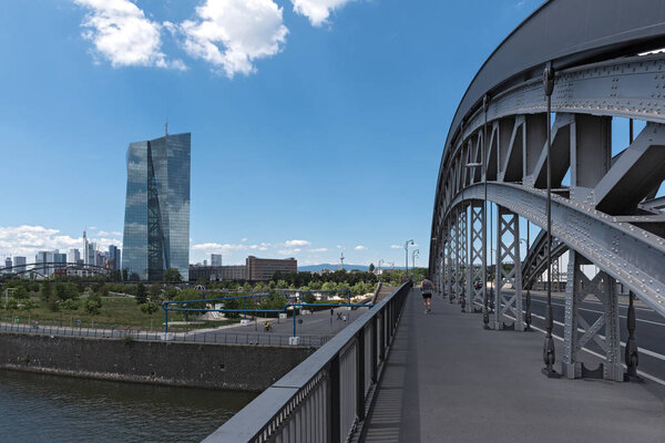 FRANKFURT AM MAIN, GERMANY-JUNE 27, 2018: the honsell bridge with new building of the european central bank (ezb) in Frankfurt am main, germany