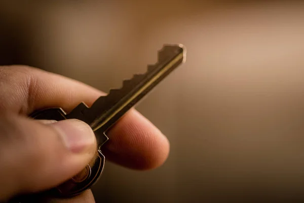 Close up key in hand.
