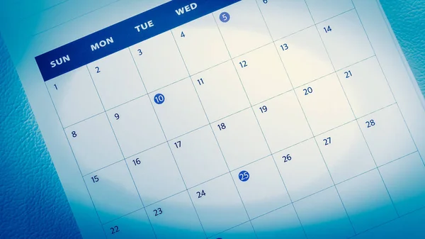 Blurred calendar on blue tone. — Stock Photo, Image