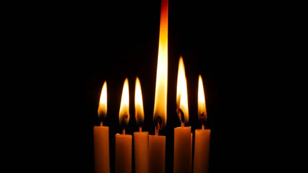 Blurred candles light on black background. — Stock Photo, Image