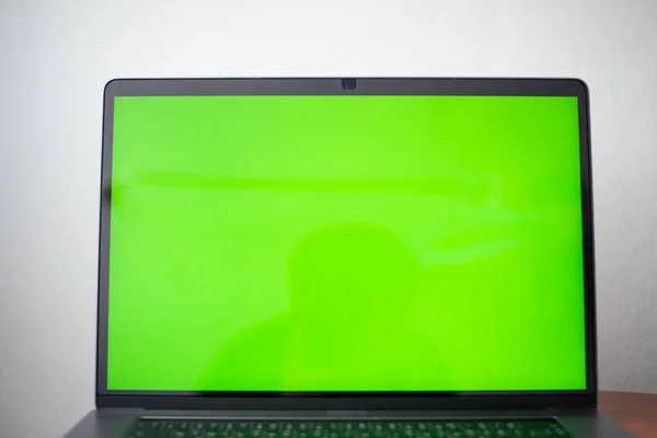 Close up laptop with green screen technology concept.