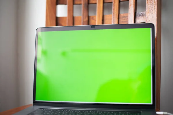 Close up laptop with green screen technology concept.
