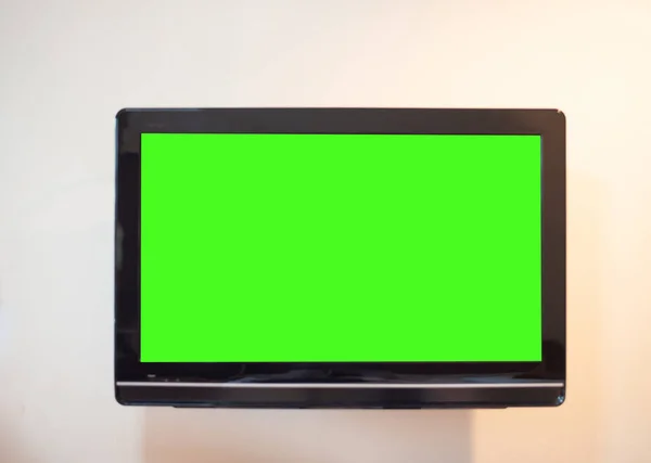 Monitor Vicino Schermo Verde Sullo Sfondo Della Parete — Foto Stock