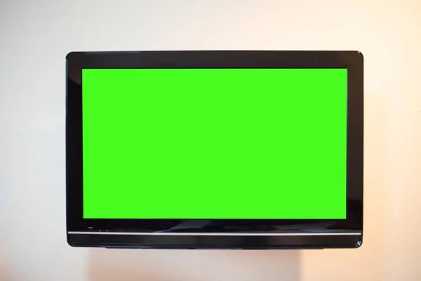 Monitor Vicino Schermo Verde Sullo Sfondo Della Parete — Foto Stock