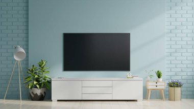 Oturma odasındaki mavi duvardaki akıllı televizyon, asgari tasarım, 3D görüntüleme