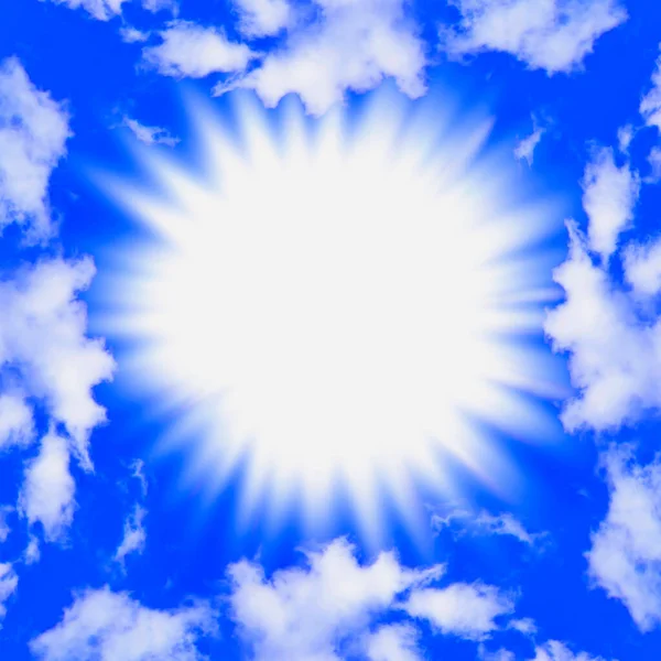 A blinding burst of light in a bright blue sky framed by fluffy white clouds.