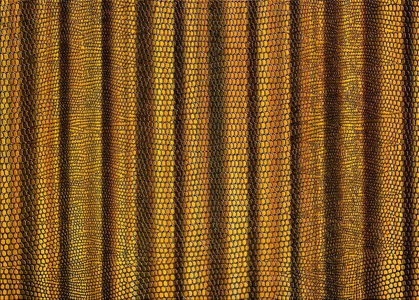 Snakeskin print curtain in golden brown for use as a background or texture