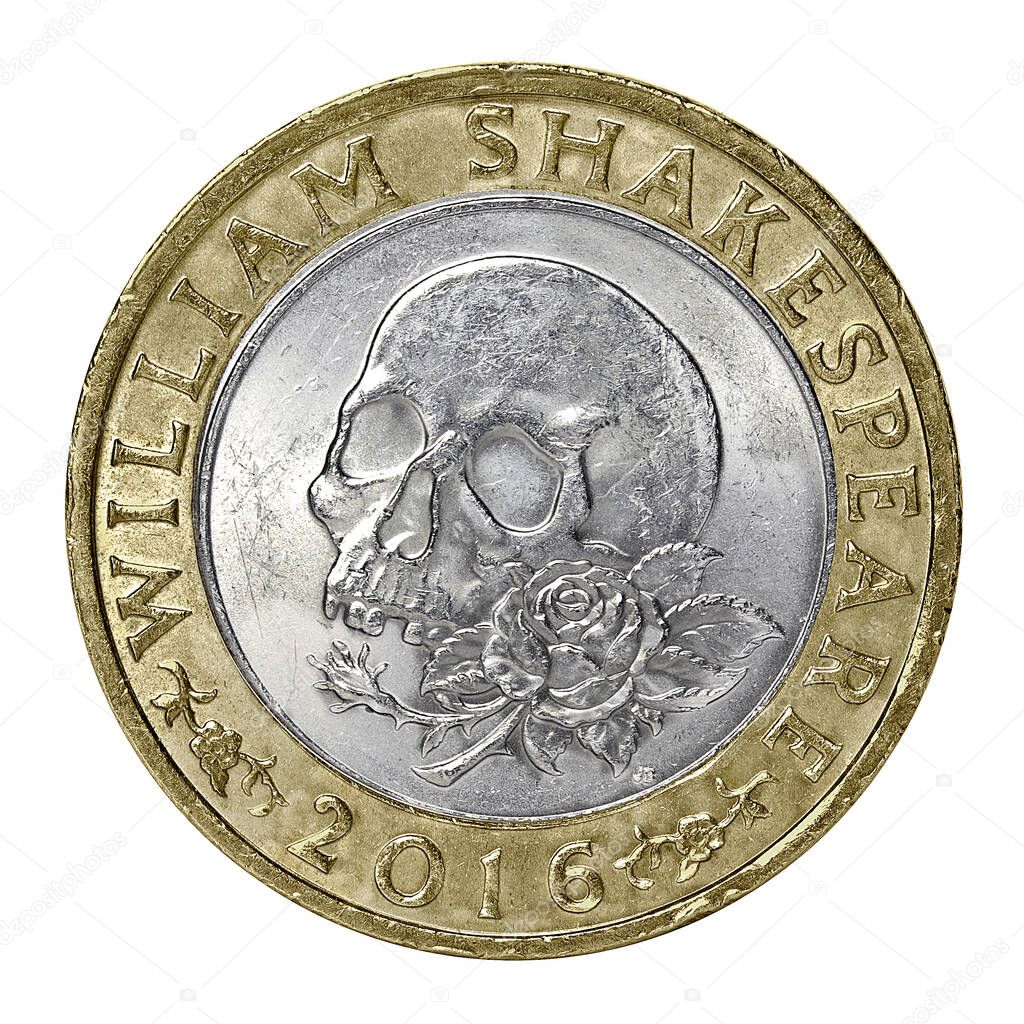 A William Shakespeare tragedies commemorative two pound coin with skull and rose design isolated on a white background 