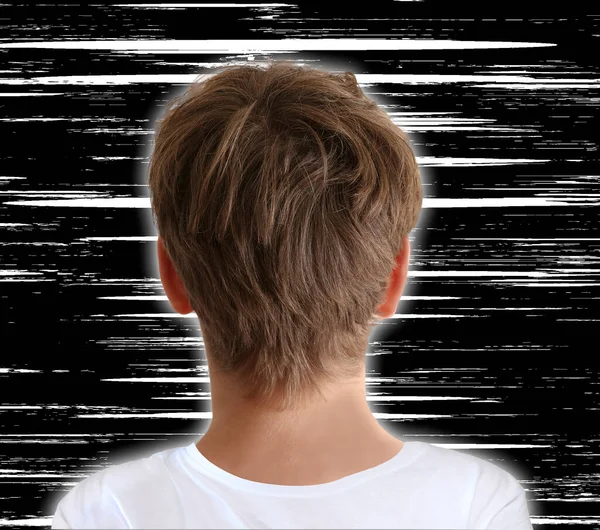 Boy watching white noise interference on tv screen