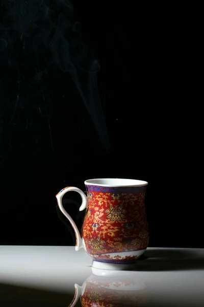 Red Tea Cup Designs Placed White Reflective Table Smokes Hot — Stock Photo, Image