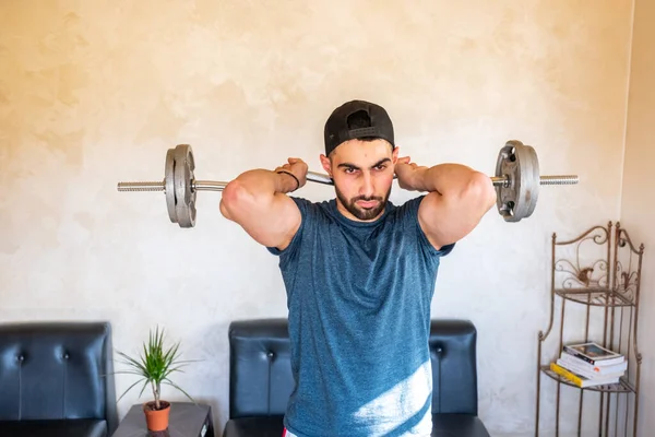 Guy doing some training at home to keep in good shape