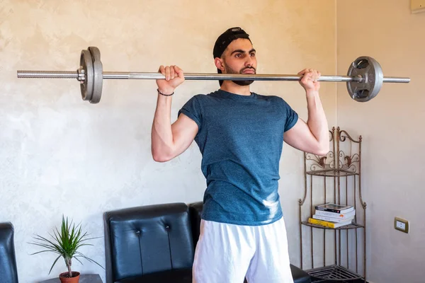 Guy doing some training at home to keep in good shape