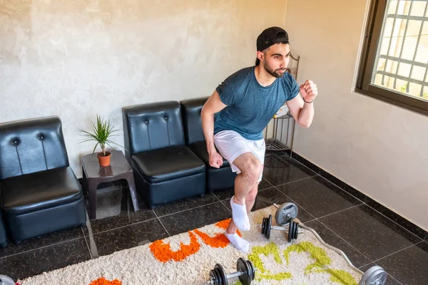 Guy doing some training at home to keep in good shape