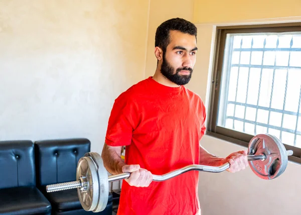 Guy doing some training at home to keep in good shape