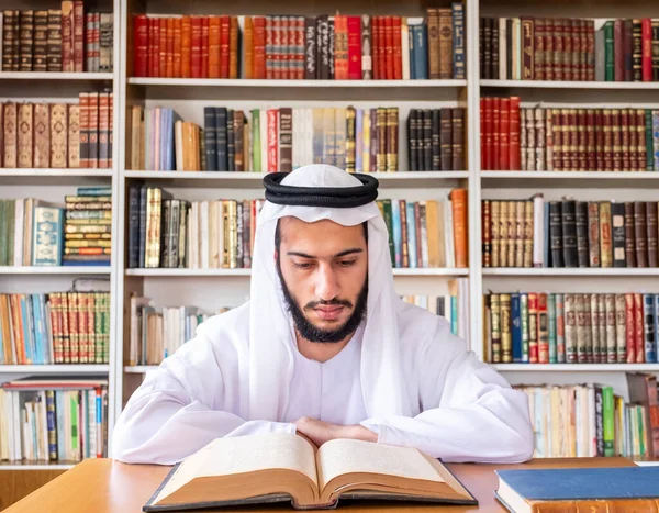 Arabic muslim man reading old books