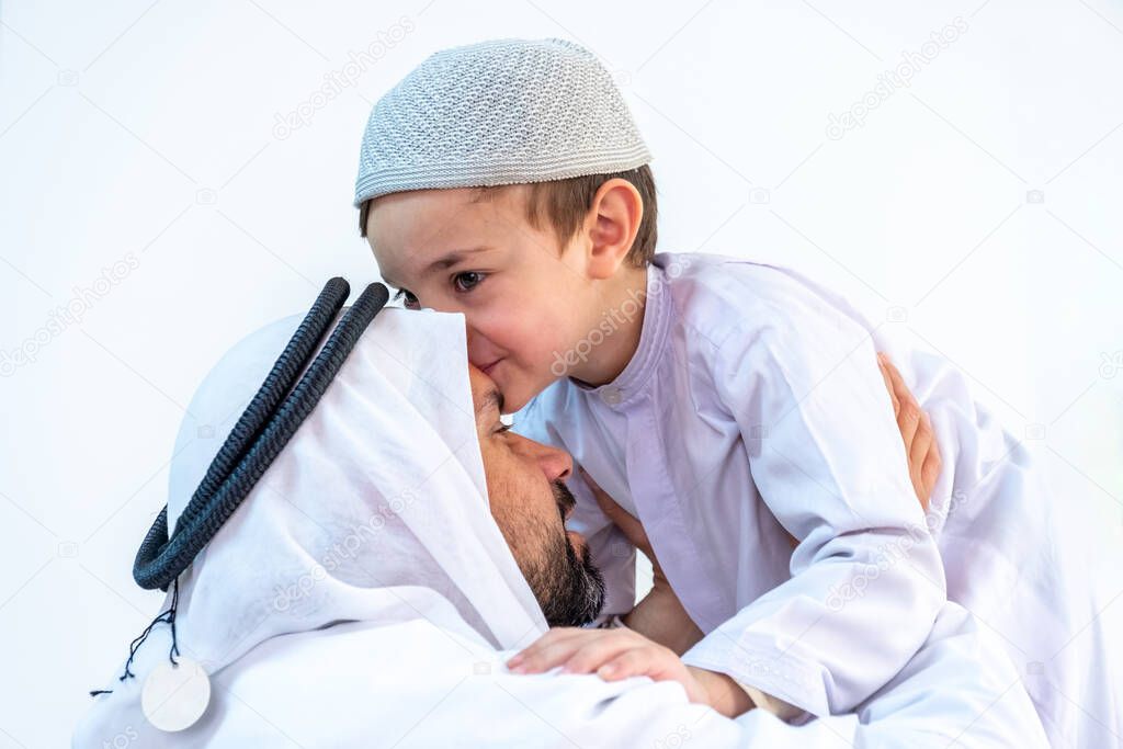 Arabic muslim son kiising his father forehead