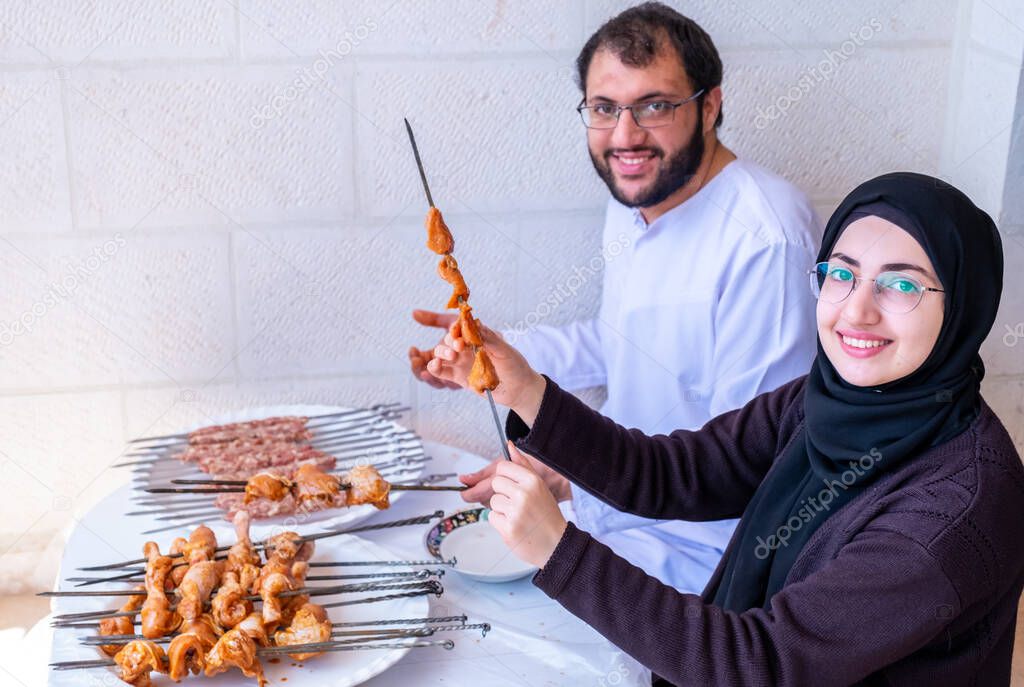 Arabic muslim family preparing for barbeque