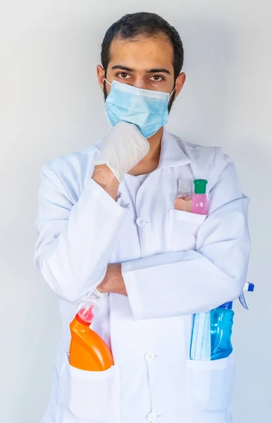 Arabic muslim, doctor holding many hygiene products