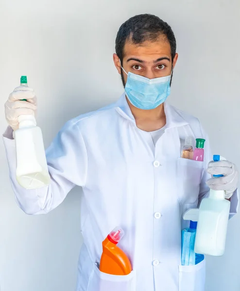 Arabic muslim, doctor holding many hygiene products