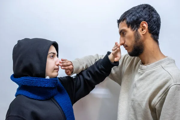 muslim woman and muslim man wearing medical mask