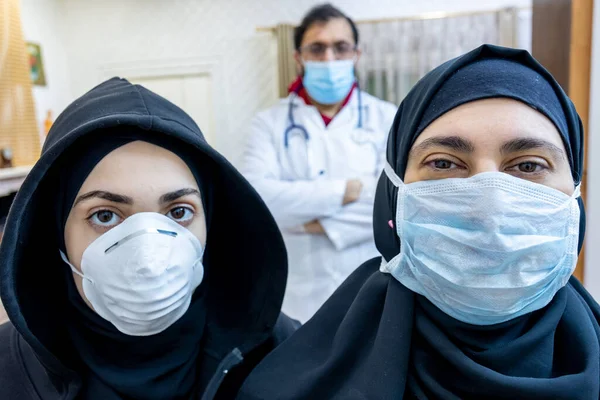 Arabic muslim family wearing masks