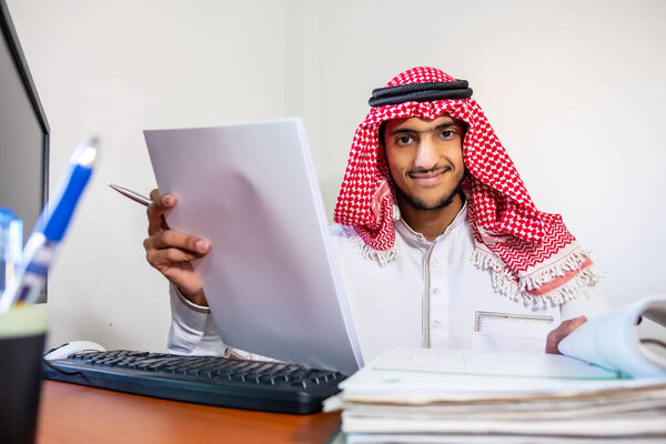 Arabic muslim employee completing the task in his hand