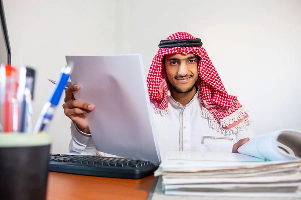 Arabic muslim employee completing the task in his hand
