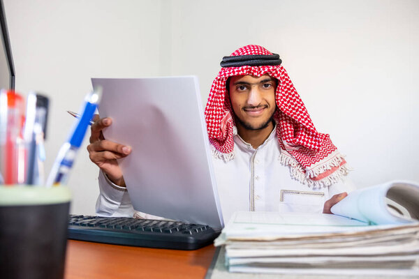 Arabic muslim employee completing the task in his hand