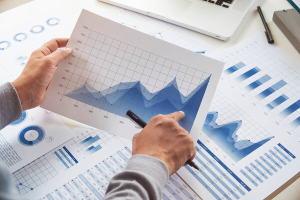 businessman working data document graph chart report marketing research development  planning management strategy analysis financial accounting. Business  office concept.
