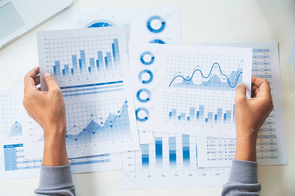 businessman working data document graph chart report marketing research development  planning management strategy analysis financial accounting. Business  office concept.