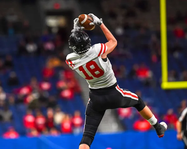 Great action photos of football players making amazing plays during a football game