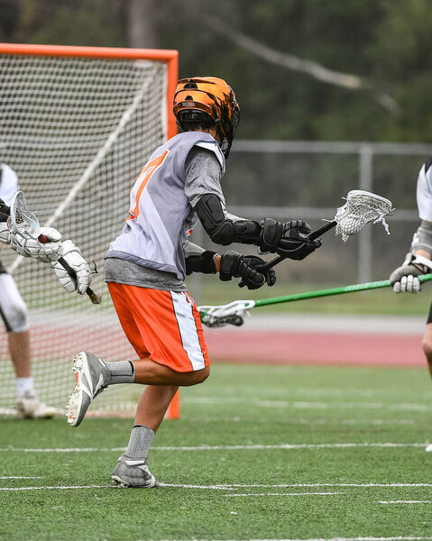 Young athletes making amazing plays while playing Lacrosse