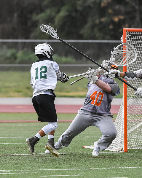 Young athletes making amazing plays while playing Lacrosse