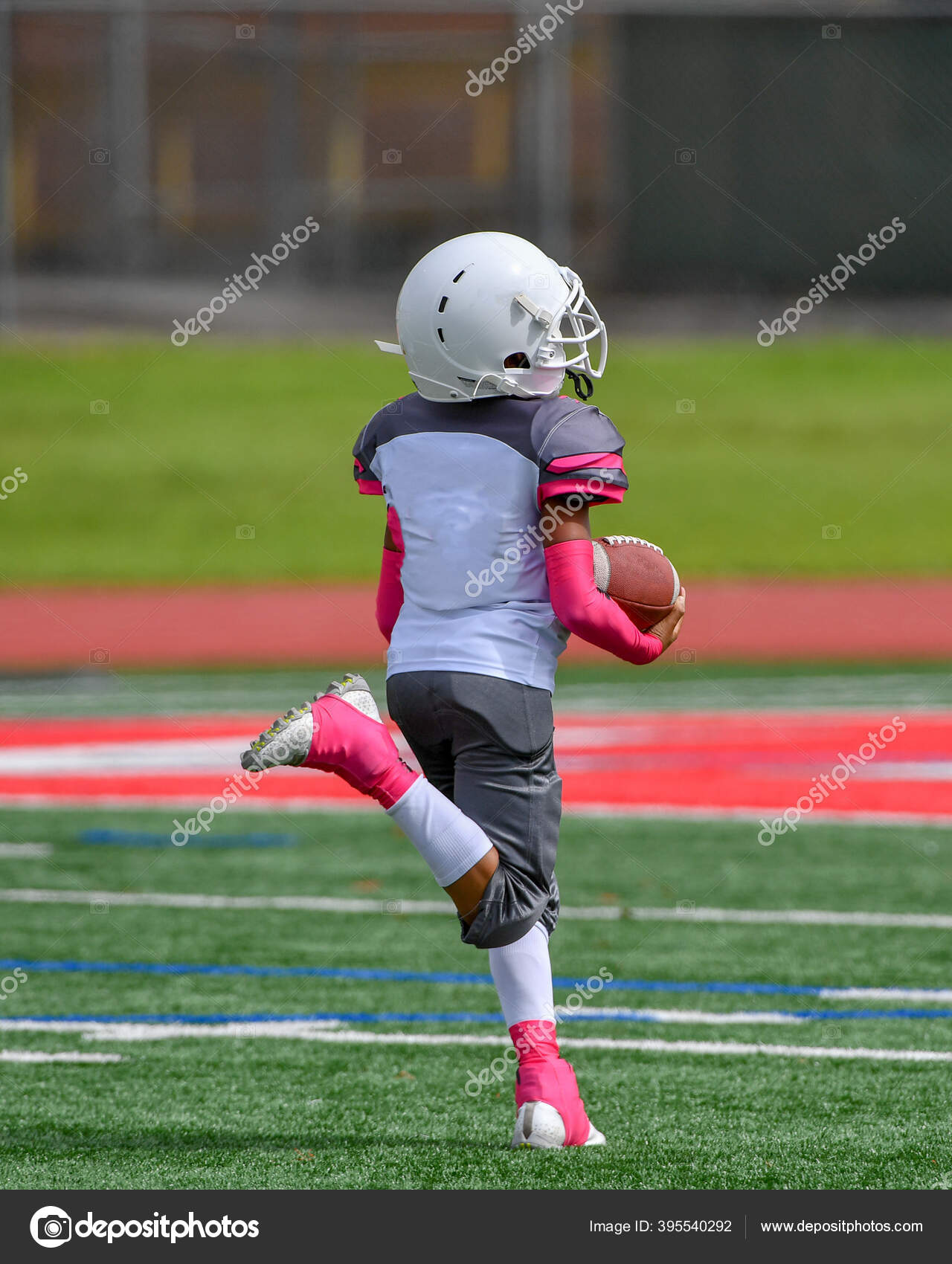 Young Kids Playing Flag Football Stock Photo by ©jbcalom 395540292