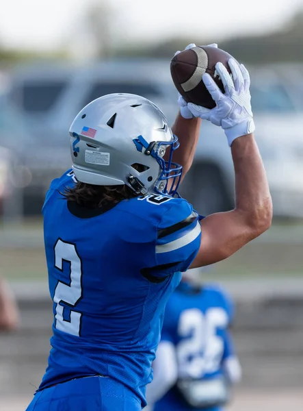 Great action photos of football players making amazing plays during a football game