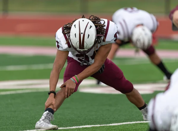 Amazing athletes making great catches and runs during a competitive football game