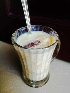 Onam special Vermicelli payasam made in a glass with a spoon with a spoon. Special desert or sweet made of vermicelli and milk of a glass. The glass is a spoon in the top..