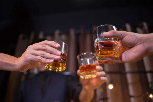 Barman pouring whiskey whiskey glass..