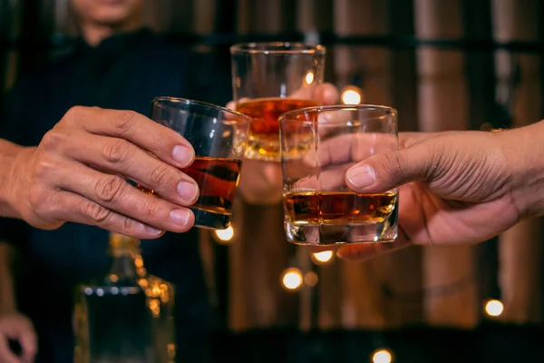 Barman pouring whiskey whiskey glass beautiful night