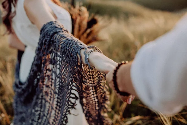 Lovers couple holding hands in a forest. Summer,spring